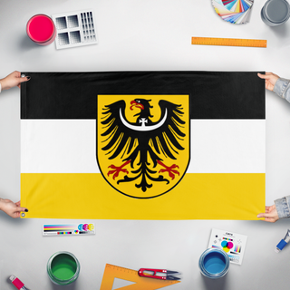 A mockup of the custom flag 'Union of Upper Silesians flag' held up on a table during print checking