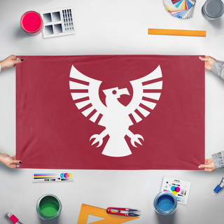 A mockup of the custom flag 'howk flag' held up on a table during print checking