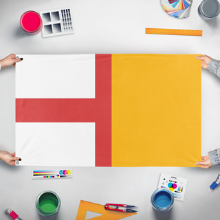 A mockup of the custom flag 'Canon 2 flag' held up on a table during print checking