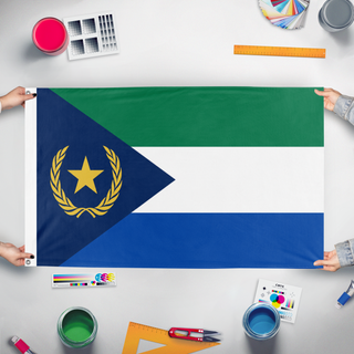 A mockup of the custom flag 'Faulu flag' held up on a table during print checking