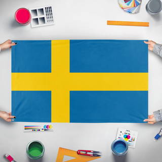 A mockup of the custom flag 'yes flag' held up on a table during print checking