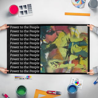 A mockup of the custom flag 'Power to the People flag' held up on a table during print checking