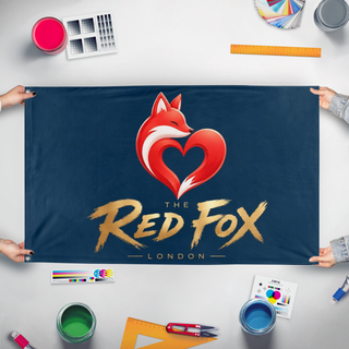 A mockup of the custom flag 'Redfox flag' held up on a table during print checking