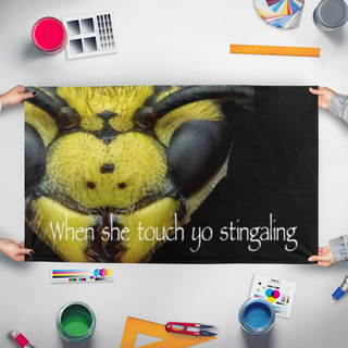 A mockup of the custom flag 'When she touch yo stingaling flag' held up on a table during print checking