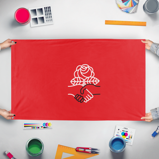 A mockup of the custom flag 'DEMOCRATIC SOCIALISTS OF AMERICA flag' held up on a table during print checking