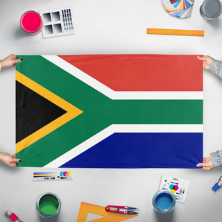 A mockup of the custom flag 'Flag of South Africa' held up on a table during print checking
