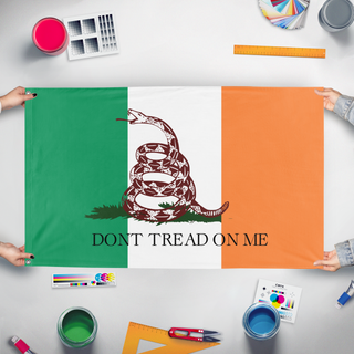 A mockup of the custom flag 'irish snake flag' held up on a table during print checking