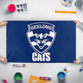 A mockup of the custom flag 'csgeelong flag' held up on a table during print checking