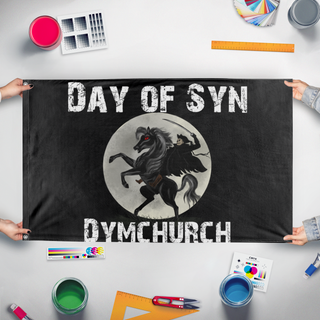 A mockup of the custom flag 'Day of Syn flag' held up on a table during print checking