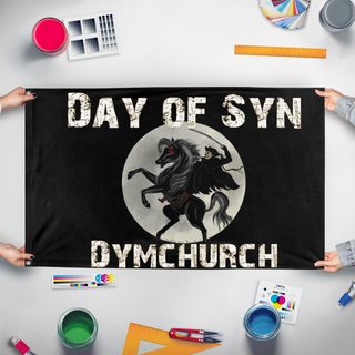 A mockup of the custom flag 'Day of Syn flag' held up on a table during print checking