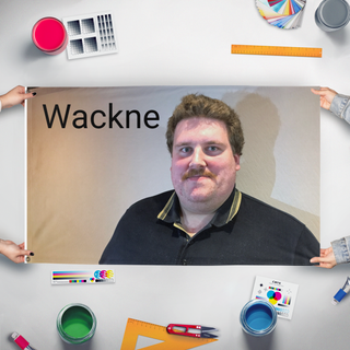A mockup of the custom flag 'Wackne flag' held up on a table during print checking