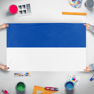 A mockup of the custom flag 'Duchy of Brunswick 1814-1830 flag' held up on a table during print checking