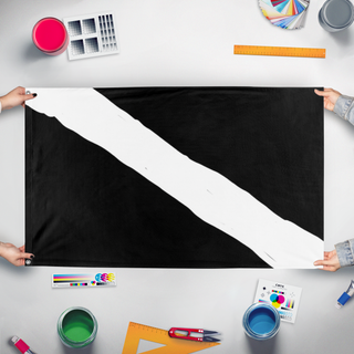 A mockup of the custom flag 'Diag flag' held up on a table during print checking