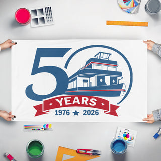A mockup of the custom flag '50yr flag' held up on a table during print checking