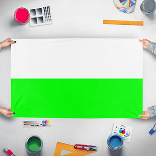 A mockup of the custom flag 'Aalten flag' held up on a table during print checking