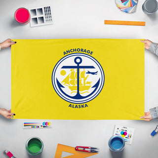A mockup of the custom flag 'Anchorage Flag' held up on a table during print checking