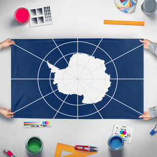 A mockup of the custom flag 'Antarctica Flag' held up on a table during print checking