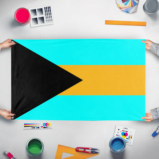 A mockup of the custom flag 'Bahamas flag' held up on a table during print checking