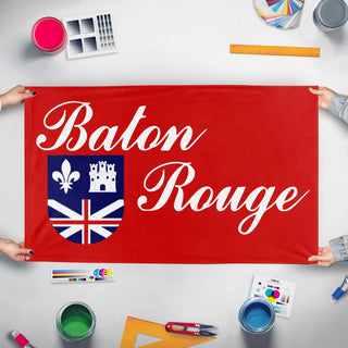 A mockup of the custom flag 'Baton Rouge City Flag' held up on a table during print checking