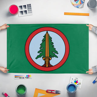 A mockup of the custom flag 'Bookhouse flag' held up on a table during print checking