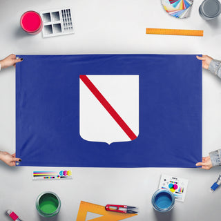 A mockup of the custom flag 'Campania Flag' held up on a table during print checking