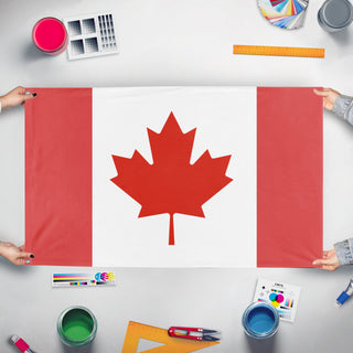 A mockup of the custom flag 'Canada flag' held up on a table during print checking