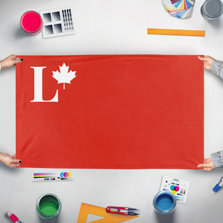A mockup of the custom flag 'Canadian Silver Legion flag' held up on a table during print checking