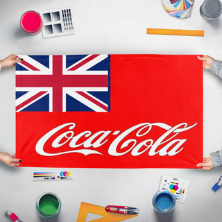 A mockup of the custom flag 'Coca Cola Empire flag' held up on a table during print checking
