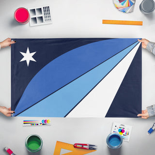 A mockup of the custom flag 'Columbia City Flag' held up on a table during print checking