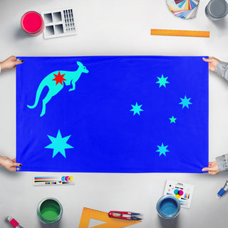 A mockup of the custom flag 'Commonwealth of Australia flag' held up on a table during print checking