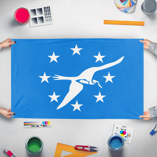 A mockup of the custom flag 'Corpus Christi City Flag' held up on a table during print checking