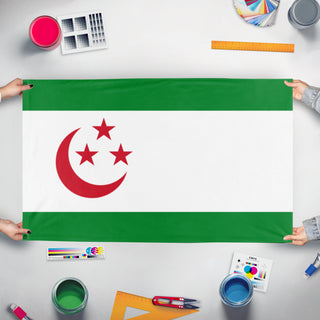 A mockup of the custom flag 'Dahanuh flag' held up on a table during print checking