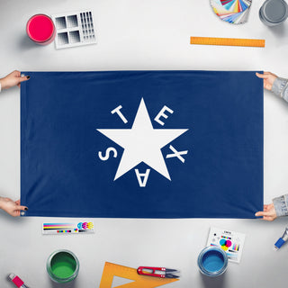 A mockup of the custom flag 'De Zavala Texas Flag' held up on a table during print checking