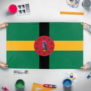 A mockup of the custom flag 'Dominica flag' held up on a table during print checking