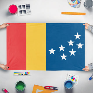 A mockup of the custom flag 'Durham City Flag' held up on a table during print checking