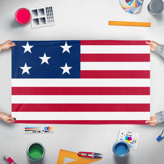 A mockup of the custom flag 'ESTADOS UNIDOS DE AMERICA flag' held up on a table during print checking