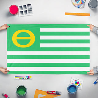 A mockup of the custom flag 'Ecology Flag' held up on a table during print checking