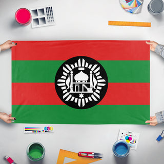 A mockup of the custom flag 'Emirate of Afghanistan flag' held up on a table during print checking