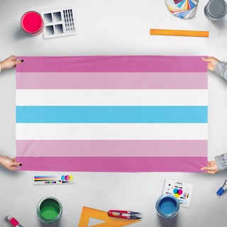 A mockup of the custom flag 'Femboy Pride flag' held up on a table during print checking