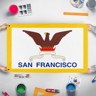 A mockup of the custom flag 'Flag of San Francisco, California' held up on a table during print checking