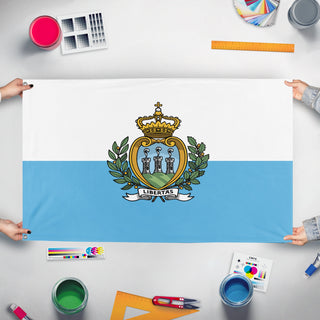 A mockup of the custom flag 'Flag of San Marino' held up on a table during print checking