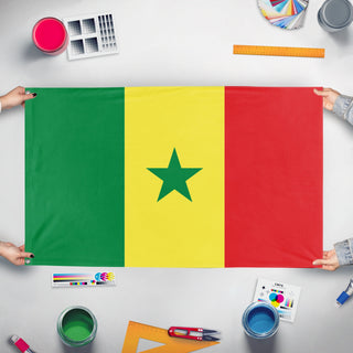 A mockup of the custom flag 'Flag of Senegal' held up on a table during print checking