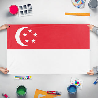 A mockup of the custom flag 'Flag of Singapore' held up on a table during print checking