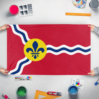 A mockup of the custom flag 'Flag of St. Louis, Missouri' held up on a table during print checking