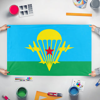 A mockup of the custom flag 'Flag of the Soviet Airborne Forces' held up on a table during print checking