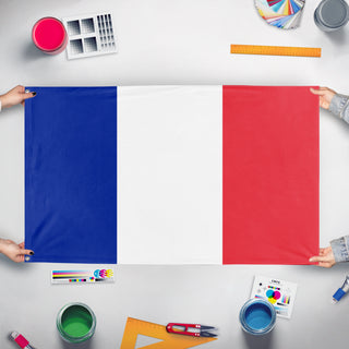 A mockup of the custom flag 'France flag' held up on a table during print checking