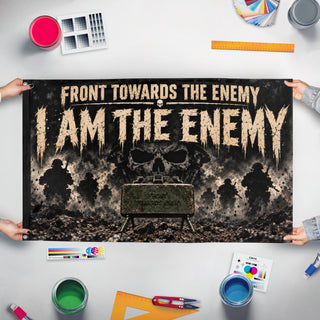 A mockup of the custom flag 'Front Towards the Enemy flag' held up on a table during print checking