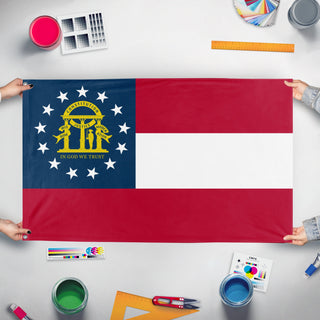 A mockup of the custom flag 'Georgia State Flag' held up on a table during print checking