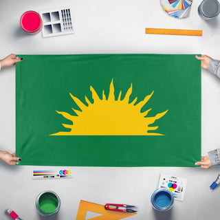 A mockup of the custom flag 'Green Sunburst flag' held up on a table during print checking