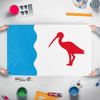 A mockup of the custom flag 'Guaramirim Redesign flag' held up on a table during print checking